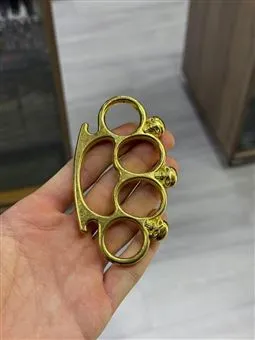 gold renk kuru kafa figürlü süs muşta detay görünüm
